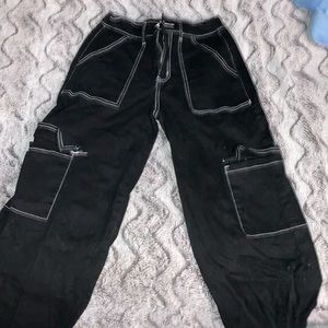 Long black pants with white stitching, rarely used and is good for any teenager!
